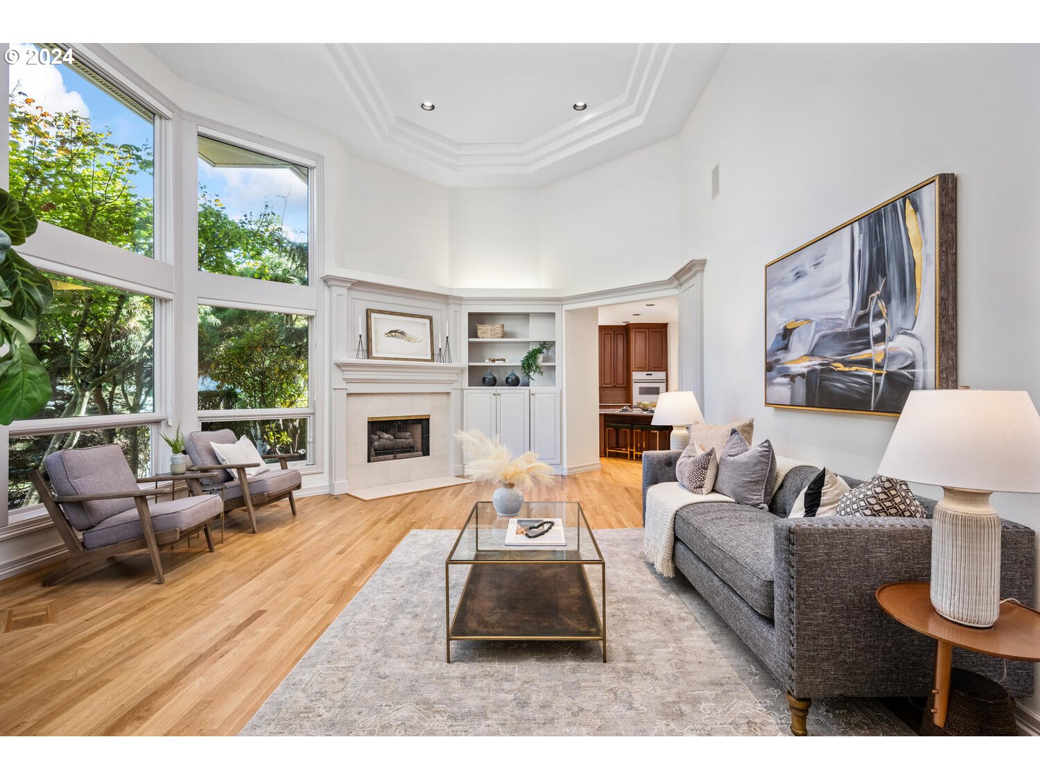 4083 Southeast Augusta Loop Gresham, OR 97080 - Photo 6 of 48 a living room with furniture a large window and a fireplace