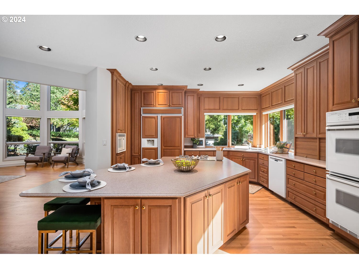 4083 Southeast Augusta Loop Gresham, OR 97080 - Photo 10 of 48 a kitchen with stainless steel appliances granite countertop a sink stove and wooden cabinets