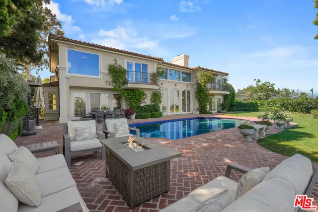 a bath room with a sink mirror and a bath tub