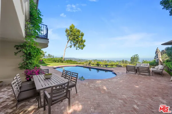 a bedroom with furniture and a flat screen tv