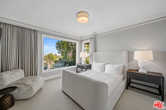 a bathroom with a sink a mirror and a shower