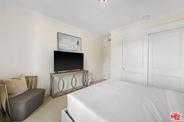a living room with furniture ceiling fan and a window