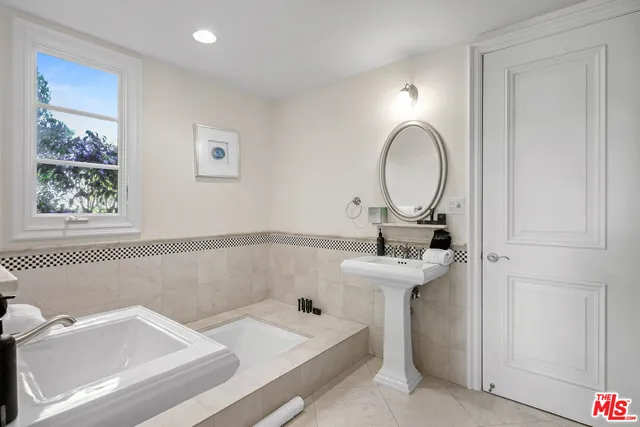 a view of walk in closet with white walls