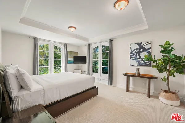a spacious bathroom with a granite countertop tub shower and mirror