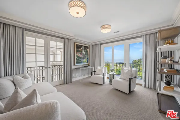 a view of an entryway with wooden floor and door