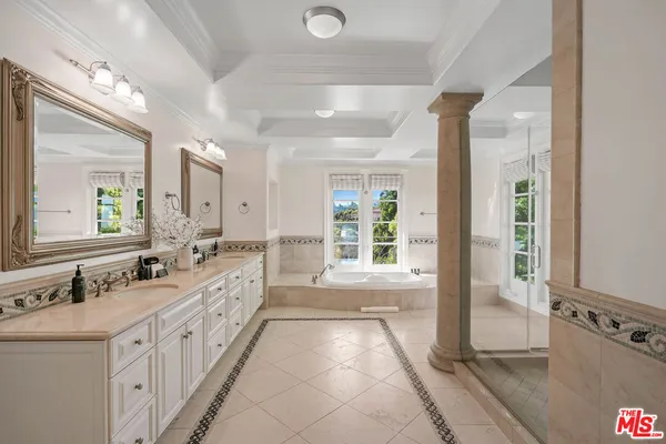 an aerial view of residential houses with city view