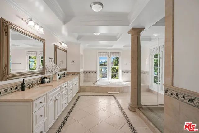 an aerial view of residential houses with city view