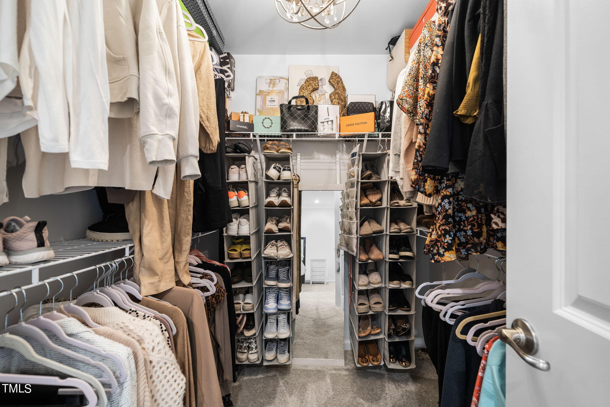 4724 Randall Road Durham, NC 27707 - Photo 21 of 47 a view of walk in closet with clothes and shoes