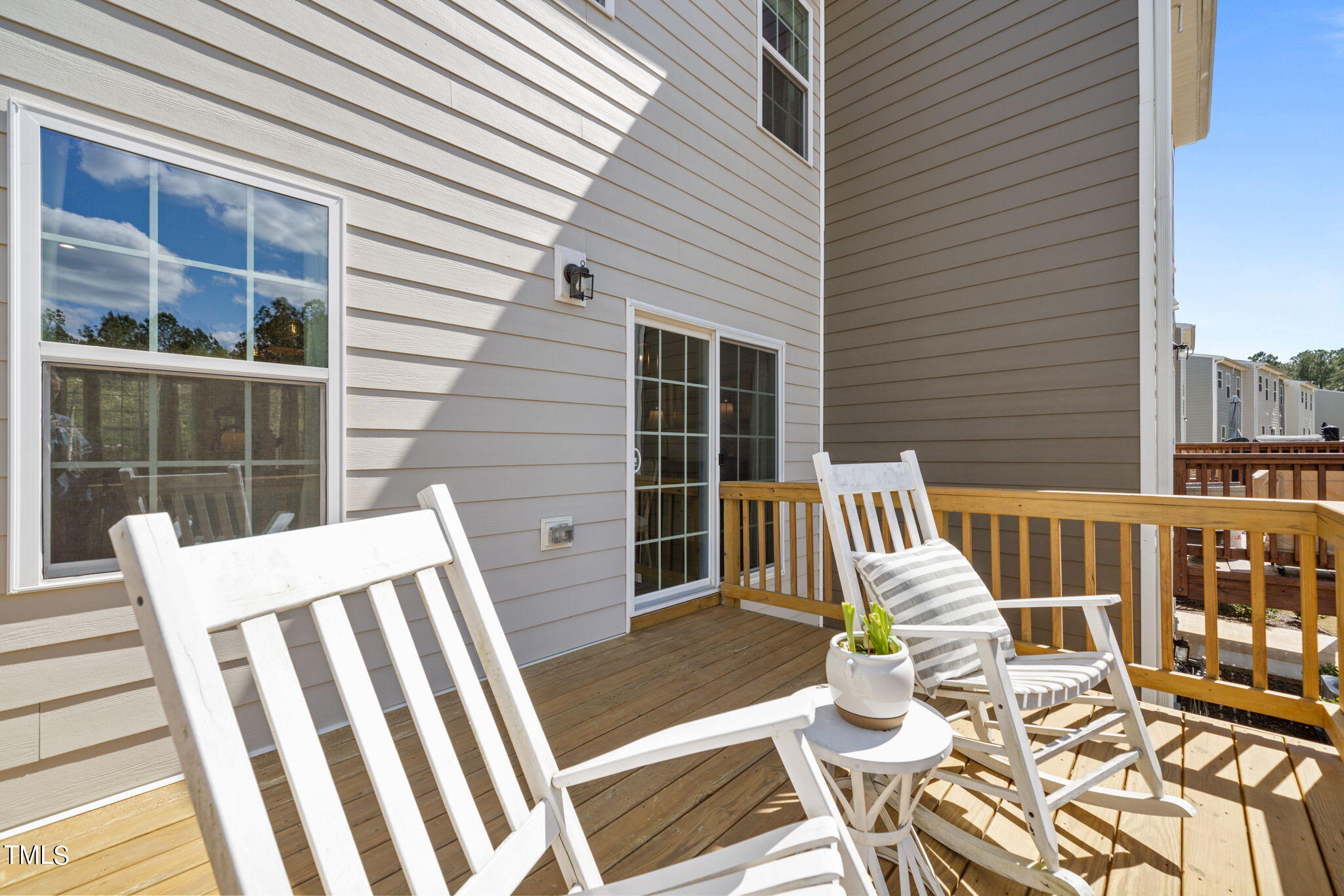 4724 Randall Road Durham, NC 27707 - Photo 36 of 47 a view of balcony with two chairs and wooden floor