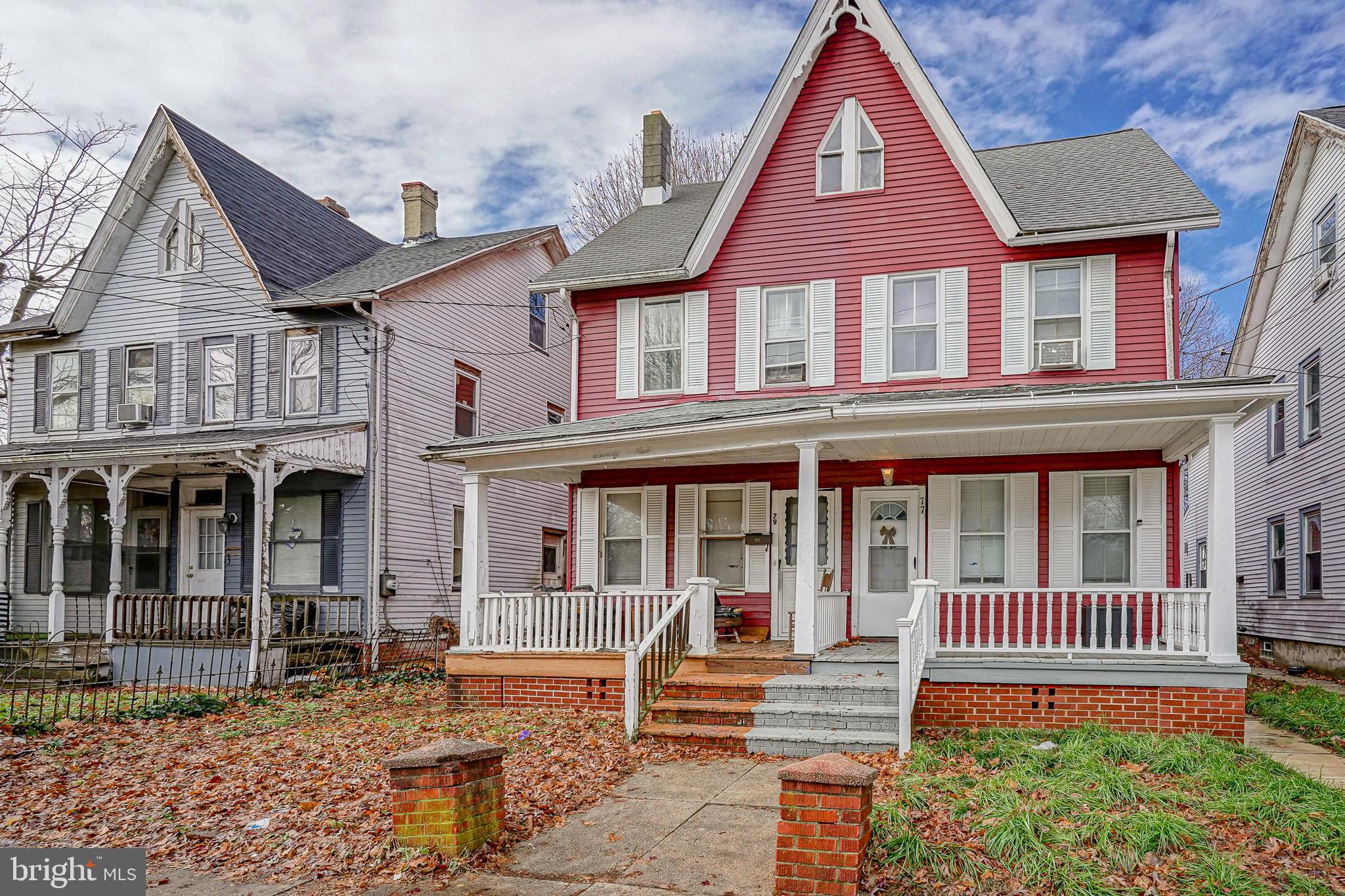 79 Walnut Street Salem, NJ 08079 - Photo 2 of 4 a front view of a house with a yard