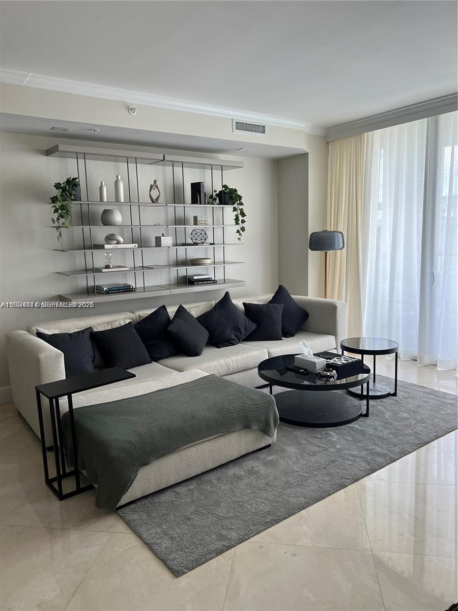 3400 Southwest 27th Avenue, Unit 1105 Miami, FL 33133 - Photo 11 of 24 a living room with furniture and a window