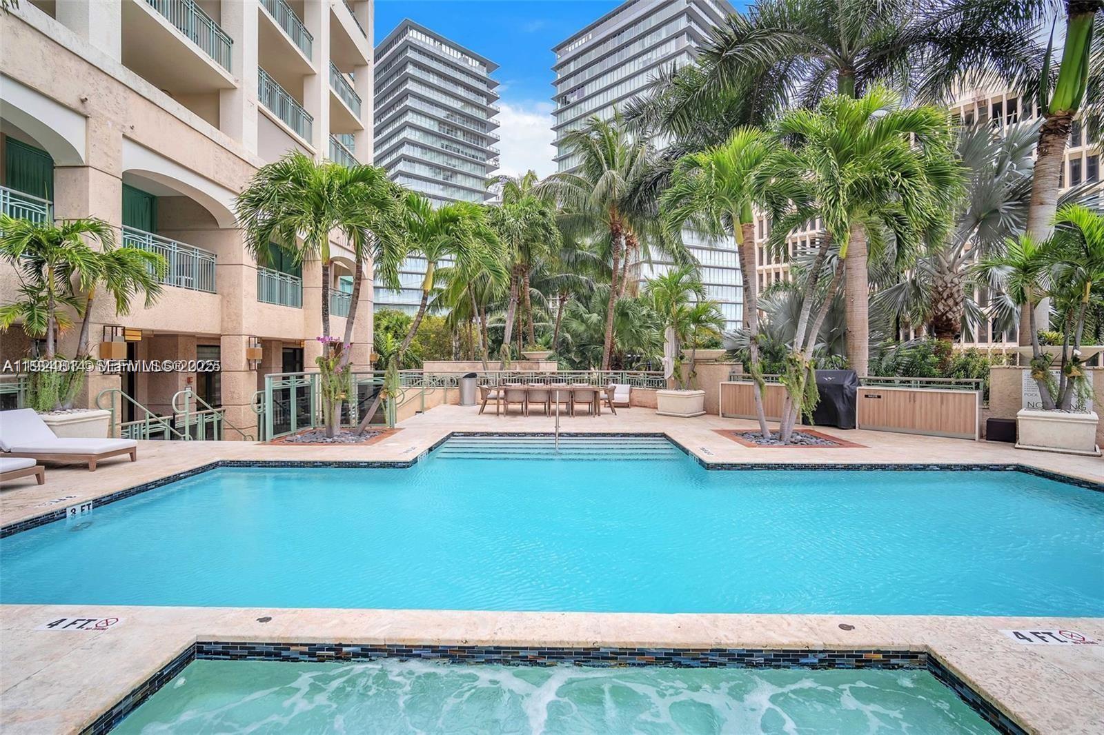 3400 Southwest 27th Avenue, Unit 1105 Miami, FL 33133 - Photo 16 of 24 a view of a patio with swimming pool