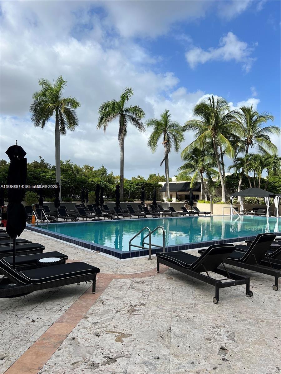 3400 Southwest 27th Avenue, Unit 1105 Miami, FL 33133 - Photo 21 of 24 a bench sitting in the middle of a park