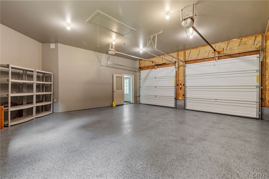 1103 Rail Fence Road Camillus, NY 13031 - Photo 45 of 50 One of the 4 bays, with epoxy flooring, wow storage galore