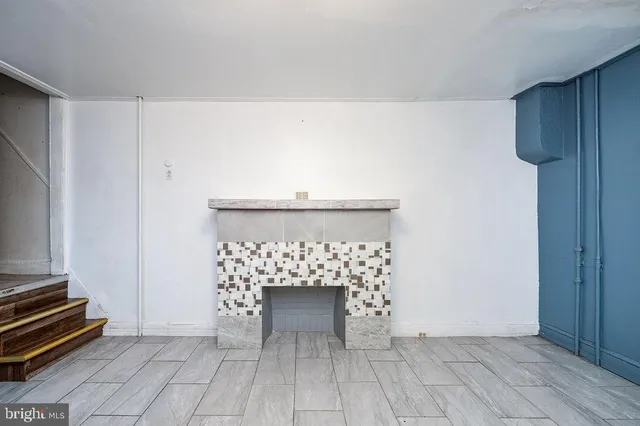 a view of a hallway with seating area and entryway