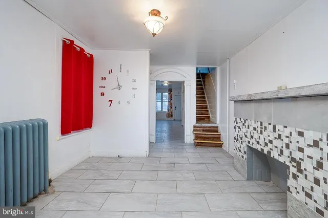a kitchen with granite countertop white cabinets stainless steel appliances and a sink