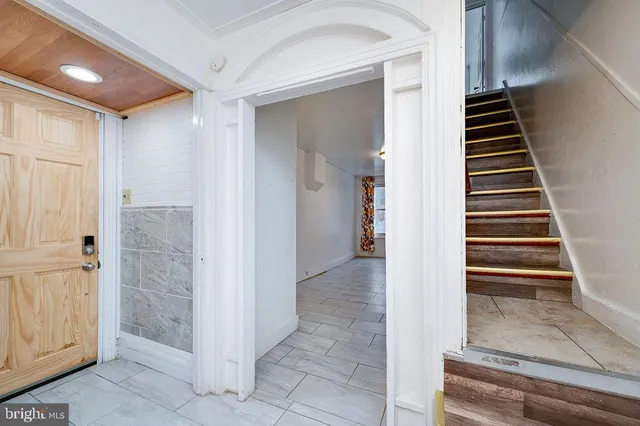 a kitchen with granite countertop a stove sink and cabinets
