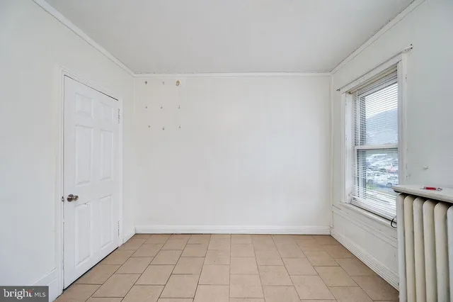 a view of a room with wooden walls and windows