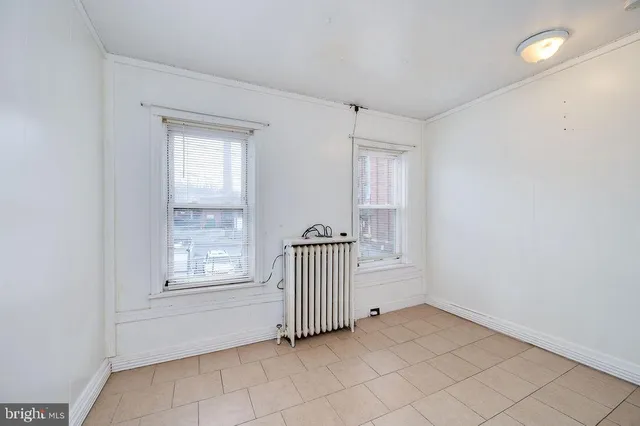 a view of a room with window and stairs