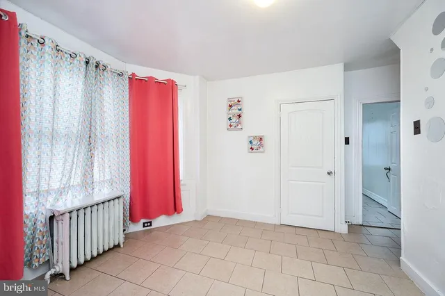 a view of hallway with wooden floor