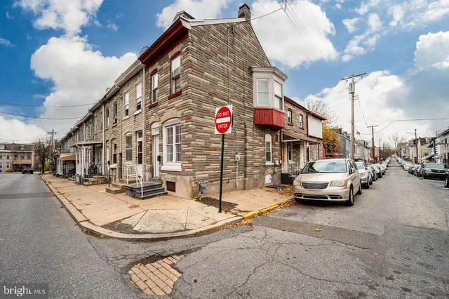 a view of street with parked cars