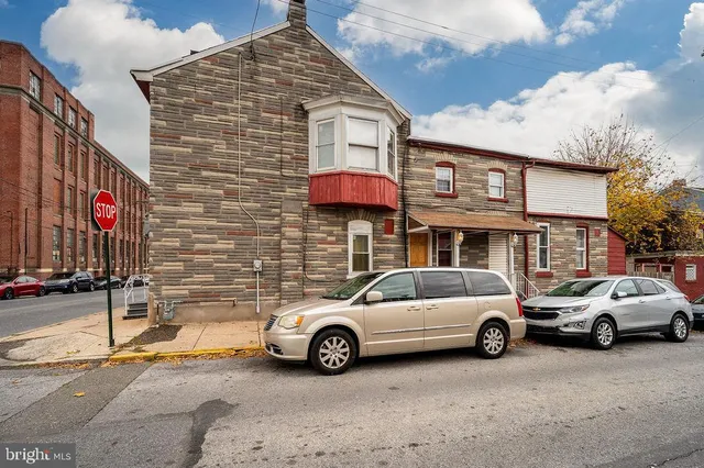 a view of a car parked in front of a building