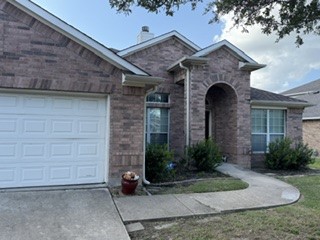 6720 Cromarty Lane Austin, TX 78754 - Photo 3 of 24 An inviting entryway welcomes you into this charming brick residence.