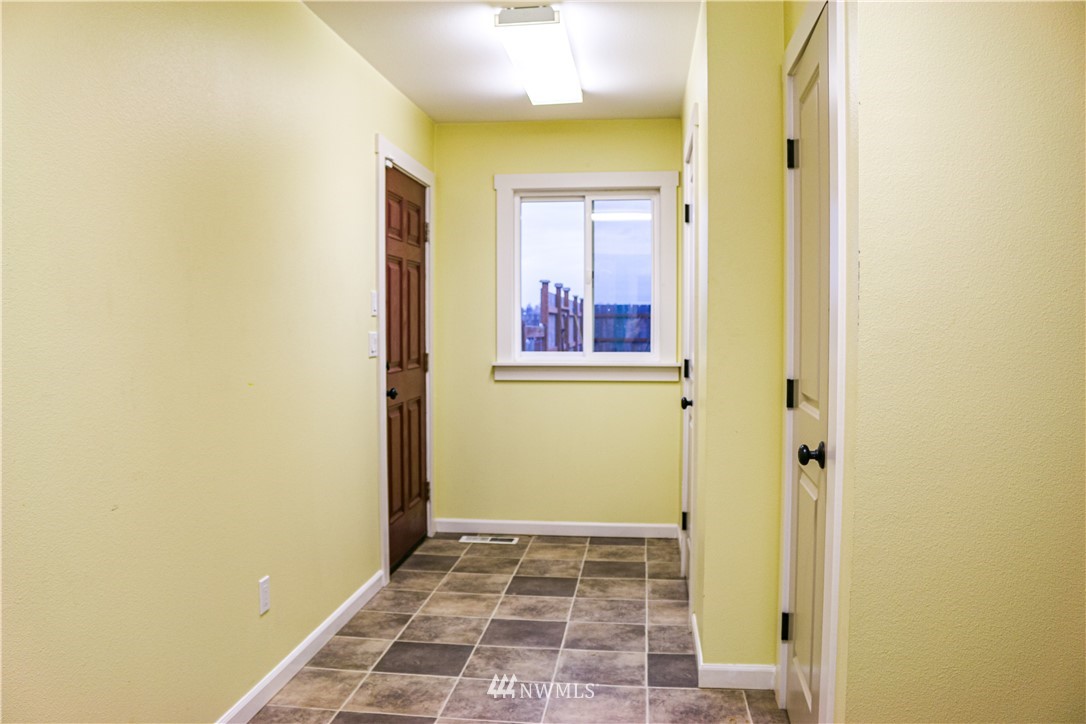 1212 Loomis Trail Road Custer, WA 98240 - Photo 22 of 32 a view of a hallway with wooden floor