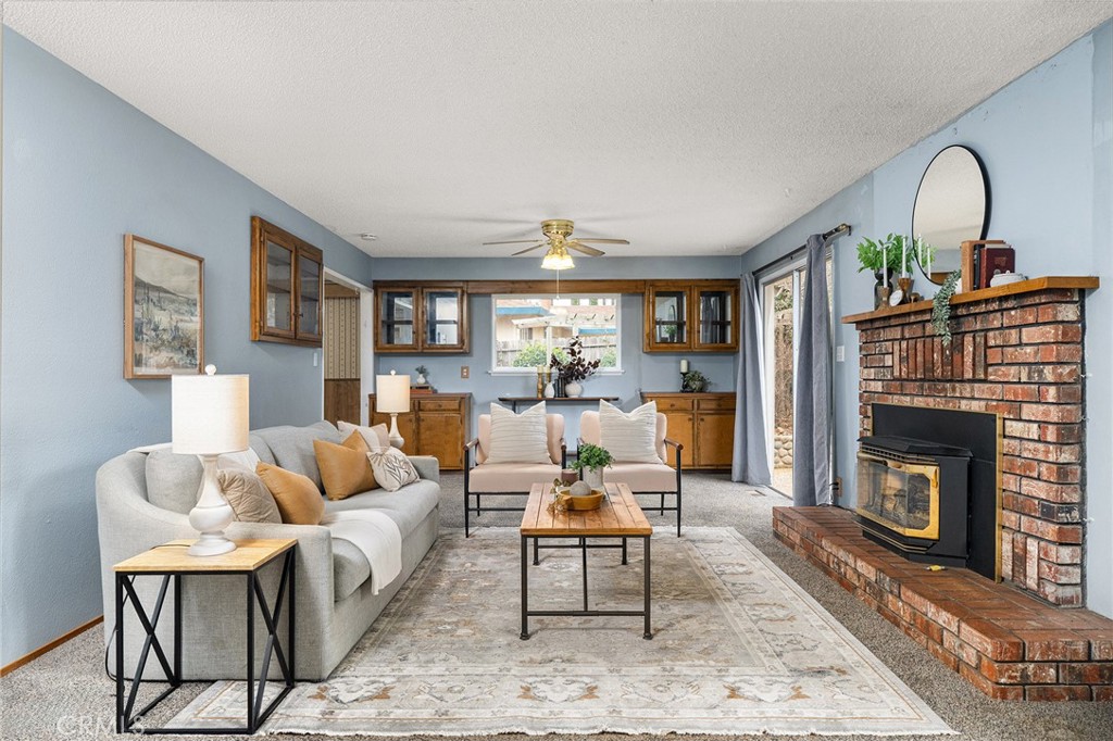 6682 Brook Way Paradise, CA 95969 - Photo 11 of 56 a living room with furniture and a fireplace