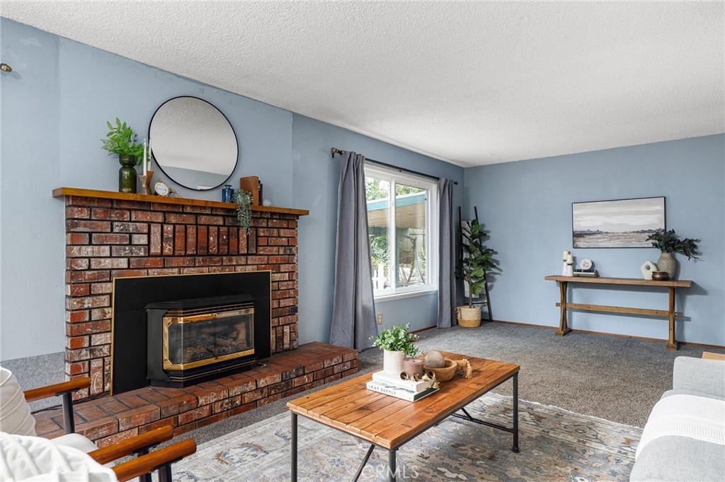 6682 Brook Way Paradise, CA 95969 - Photo 12 of 56 a living room with furniture and a fireplace