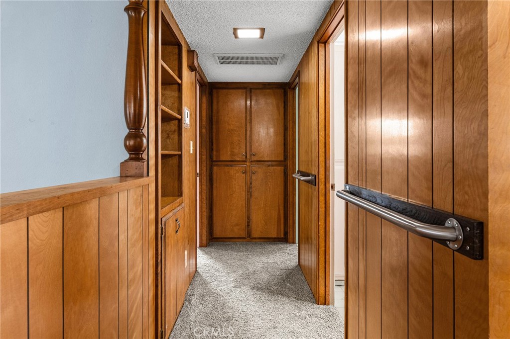6682 Brook Way Paradise, CA 95969 - Photo 17 of 56 a view of a hallway with wooden walls