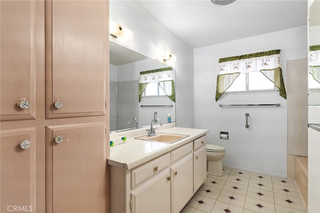 6682 Brook Way Paradise, CA 95969 - Photo 23 of 56 a bathroom with a sink a toilet and a mirror