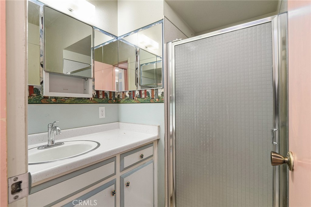 6682 Brook Way Paradise, CA 95969 - Photo 27 of 56 a bathroom with a sink and a mirror