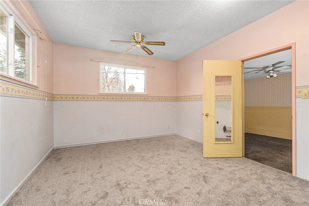 6682 Brook Way Paradise, CA 95969 - Photo 29 of 56 an empty room with windows and closet