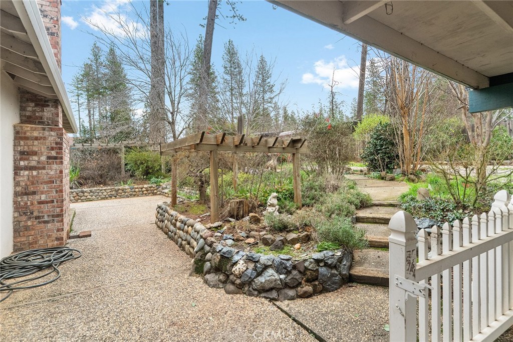 6682 Brook Way Paradise, CA 95969 - Photo 34 of 56 a view of a yard with plants and brick wall