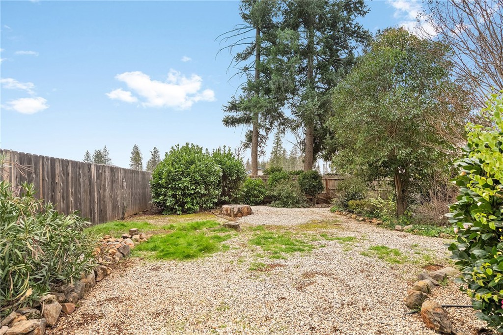 6682 Brook Way Paradise, CA 95969 - Photo 43 of 56 a view of a yard with plants and wooden fence