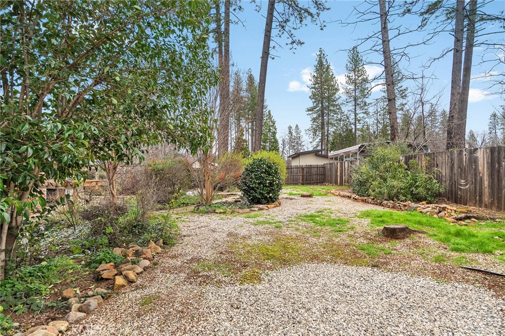 6682 Brook Way Paradise, CA 95969 - Photo 44 of 56 a backyard of a house with a yard and outdoor seating