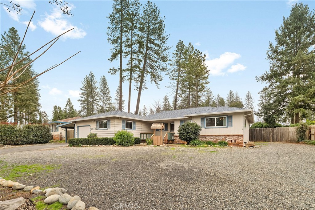 6682 Brook Way Paradise, CA 95969 - Photo 52 of 56 a front view of a house with a yard and garage