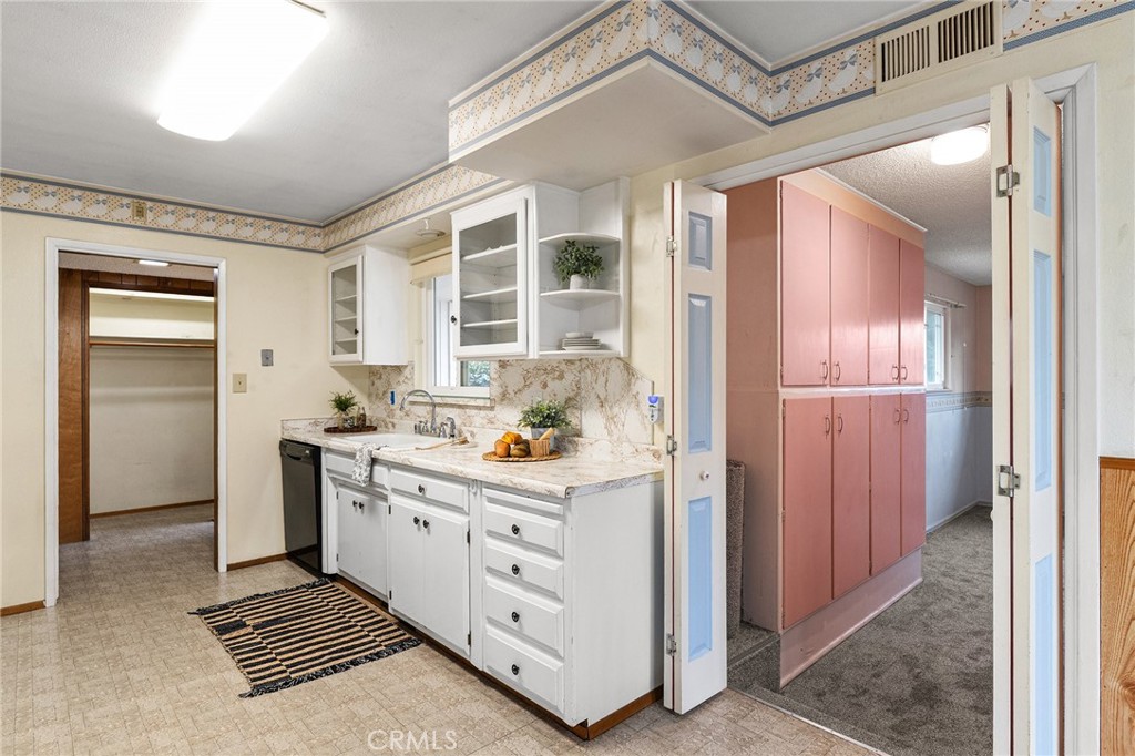 6682 Brook Way Paradise, CA 95969 - Photo 7 of 56 a kitchen with cabinets and wooden floor