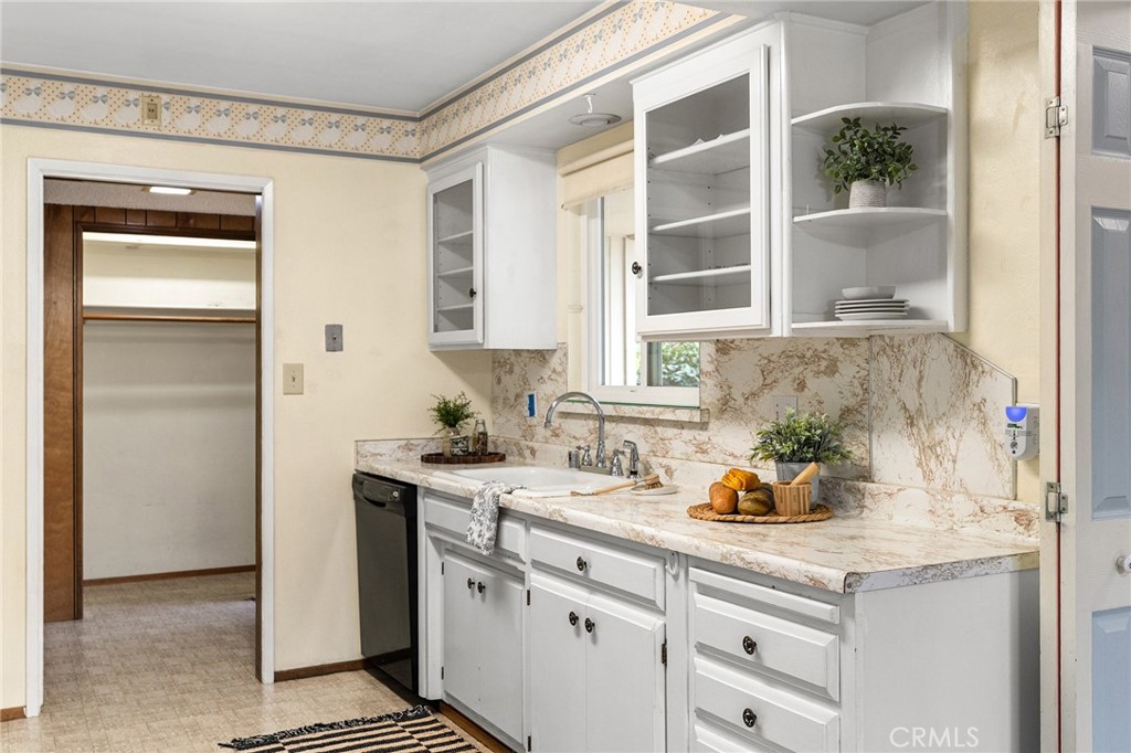 6682 Brook Way Paradise, CA 95969 - Photo 8 of 56 a kitchen with a sink and cabinets