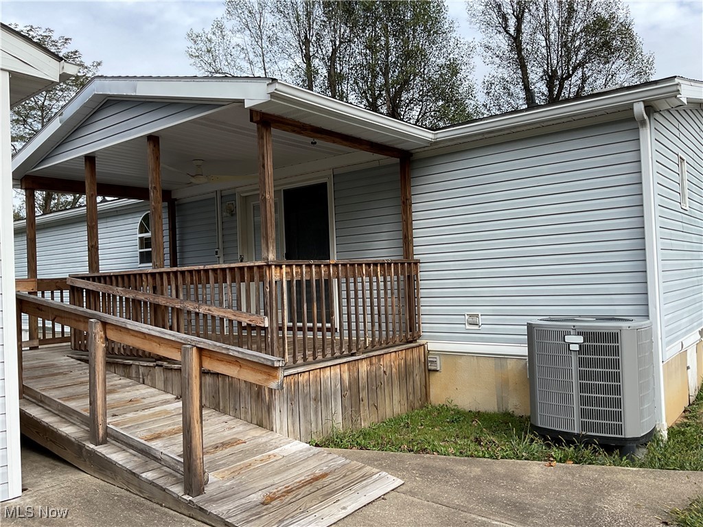 906 Greens Run Road St. Marys, WV 26170 - Photo 2 of 14 Wooden covered porch with handicap ramp