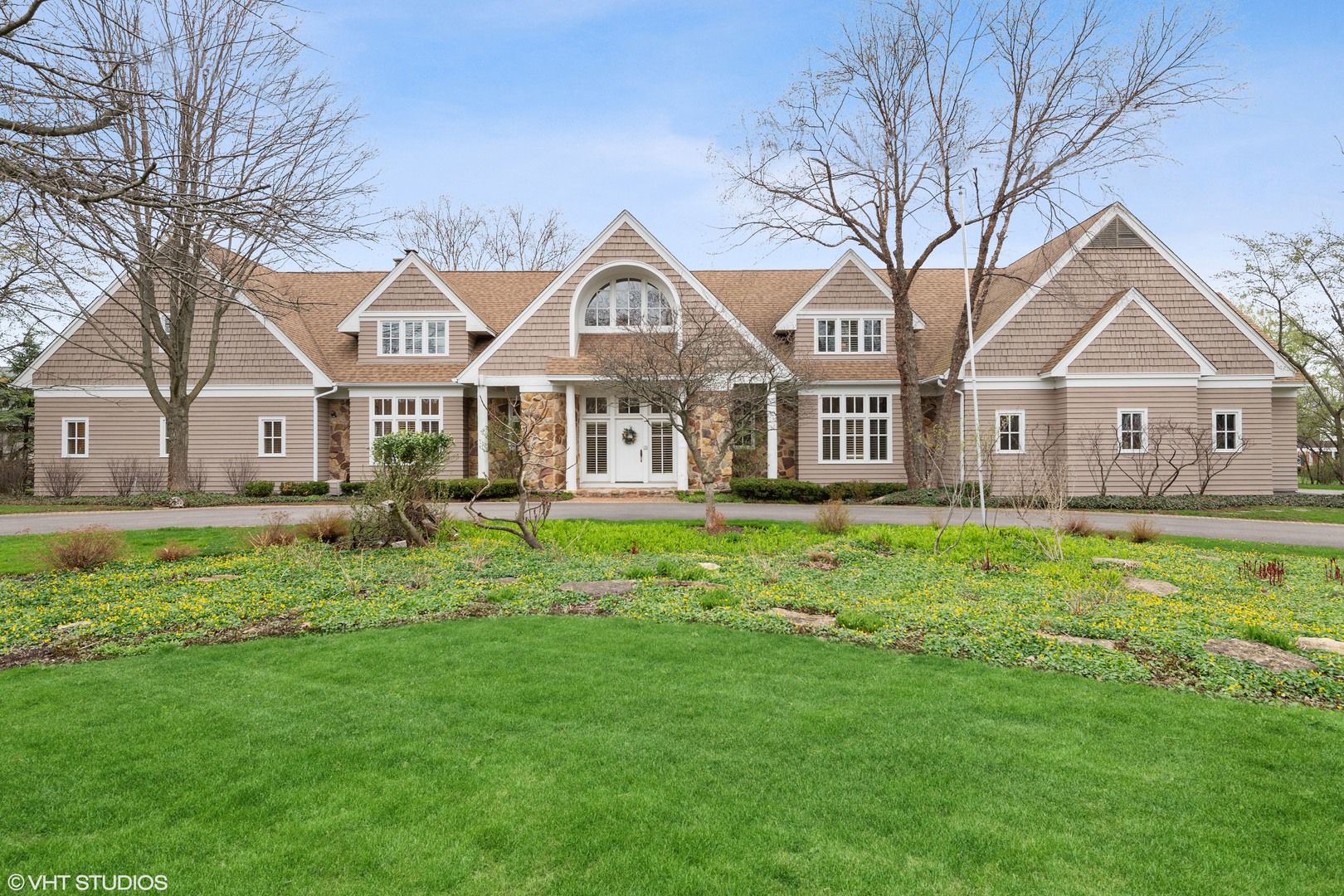 479 Lee Road Northbrook, IL 60062 - Photo 1 of 36 a view of a house with a big yard and large trees