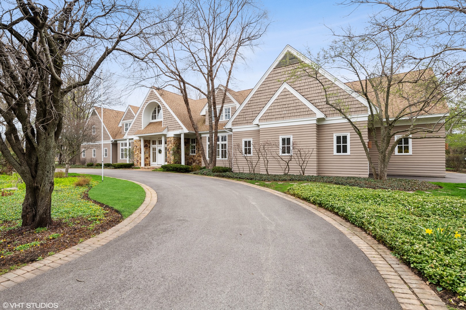 479 Lee Road Northbrook, IL 60062 - Photo 2 of 36 a view of a house with a small yard and large trees