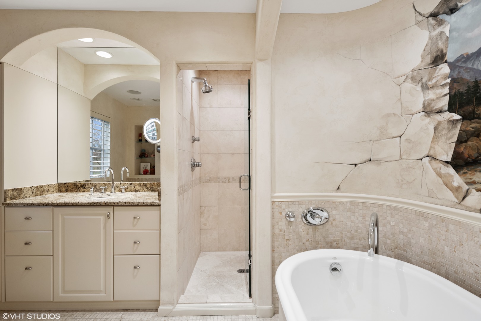 479 Lee Road Northbrook, IL 60062 - Photo 23 of 36 a bathroom with a granite countertop sink vanity mirror bathtub and shower