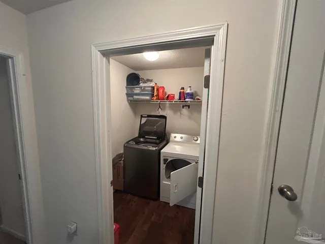 a gym room with furniture and a window