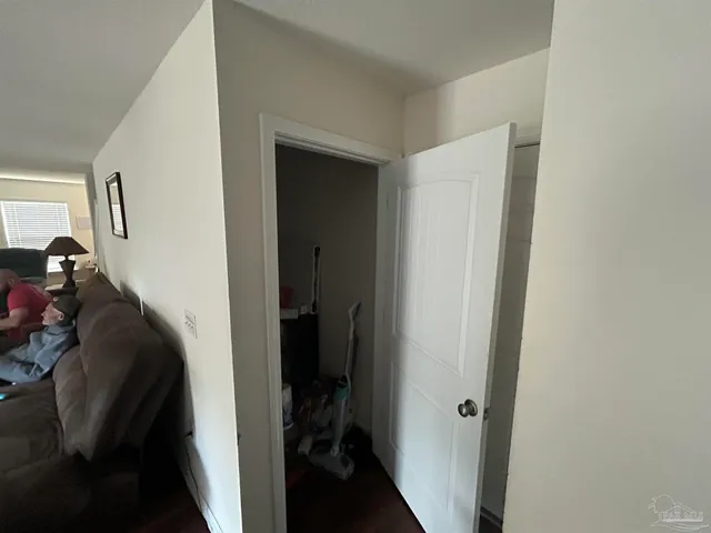 a view of a hallway with a closet
