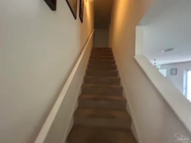 a view of a bathroom from a hallway