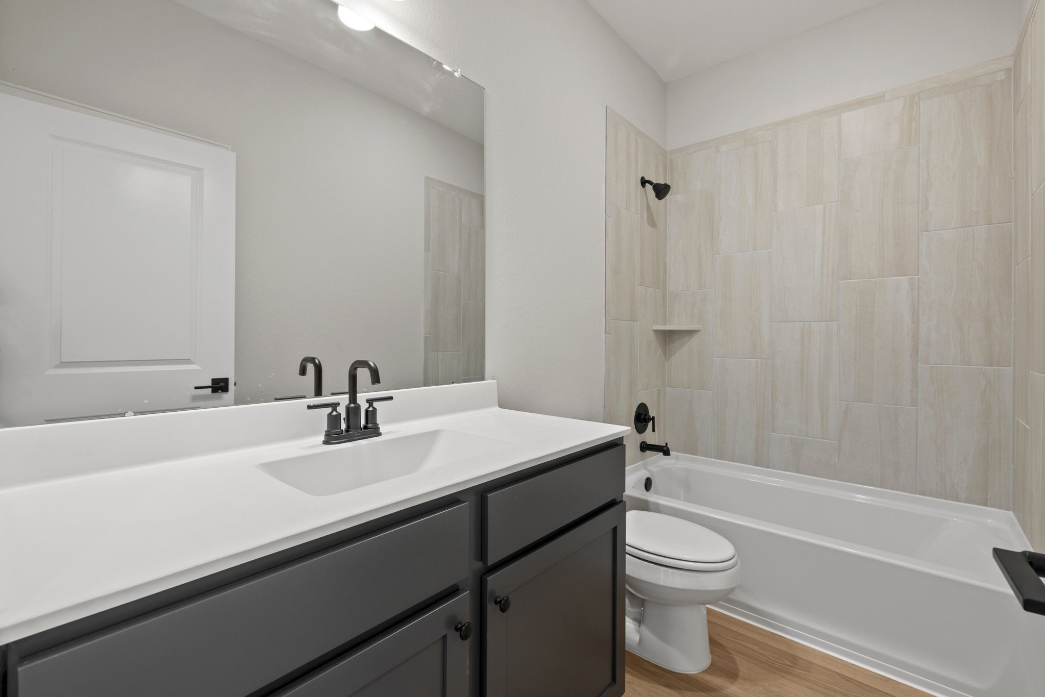 13601 Gaff Rig Drive Texas City, TX 77510 - Photo 10 of 20 a bathroom with a sink a toilet and shower