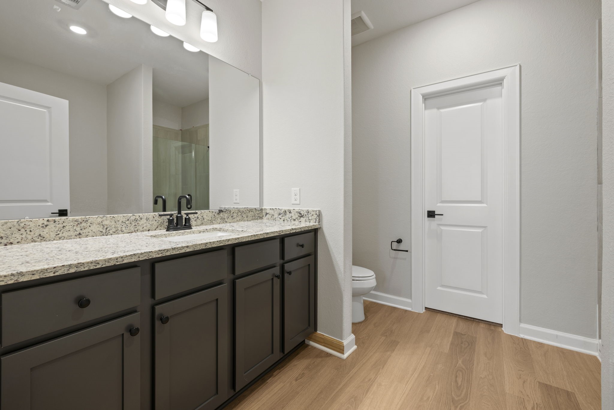 13601 Gaff Rig Drive Texas City, TX 77510 - Photo 12 of 20 a bathroom with a granite countertop sink toilet and shower