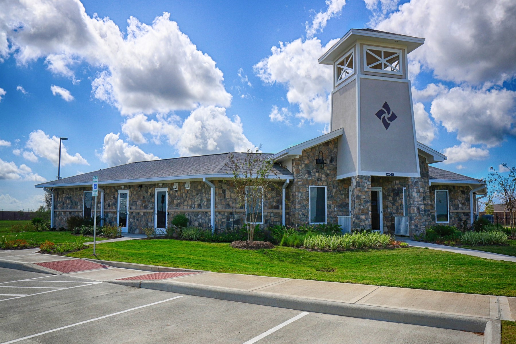 13601 Gaff Rig Drive Texas City, TX 77510 - Photo 17 of 20 a view of a white building with a big yard and large trees